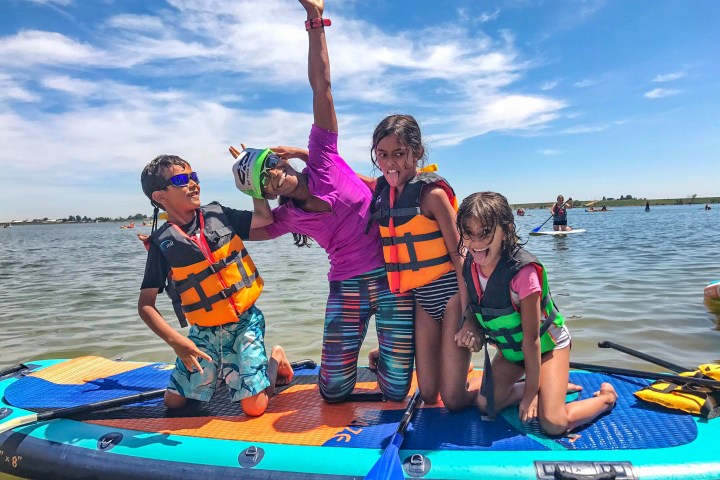 family paddle boarding