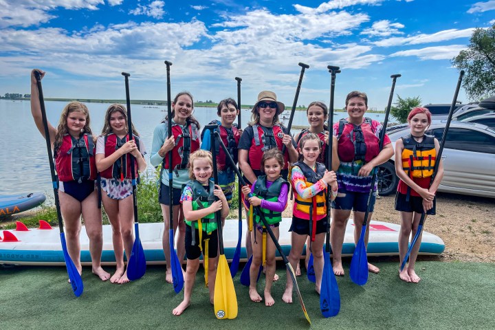 Girl Scout Troop learning to paddleboard