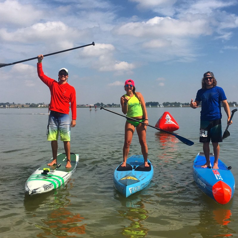 Three paddleboarders on the lake