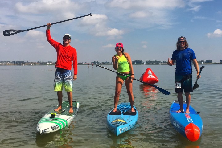 Three paddleboarders on the lake