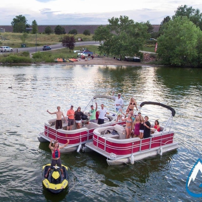 Two pontoon boats next to each other