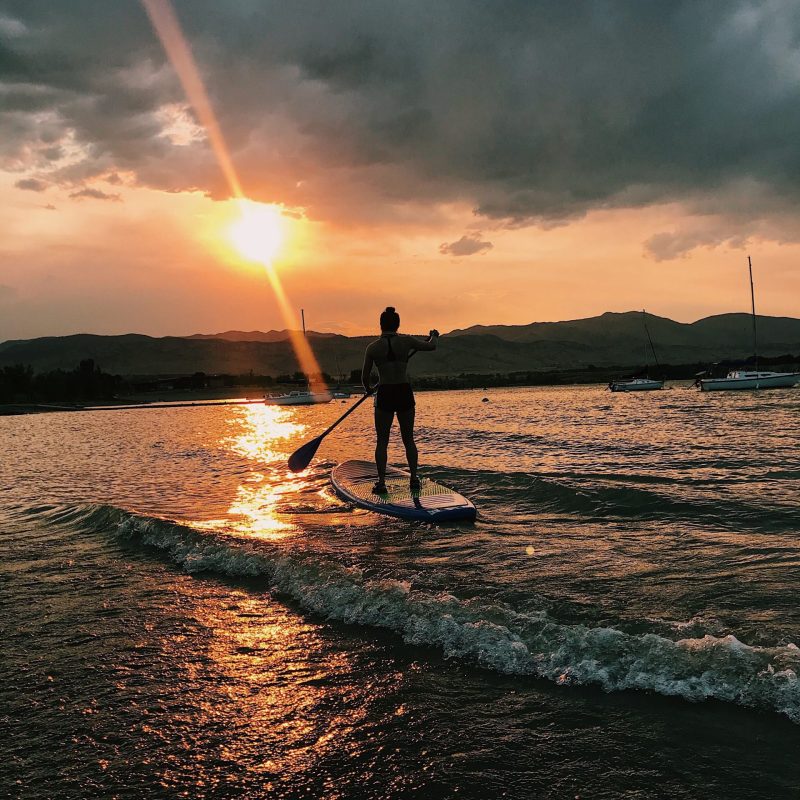 a sunset over a body of water