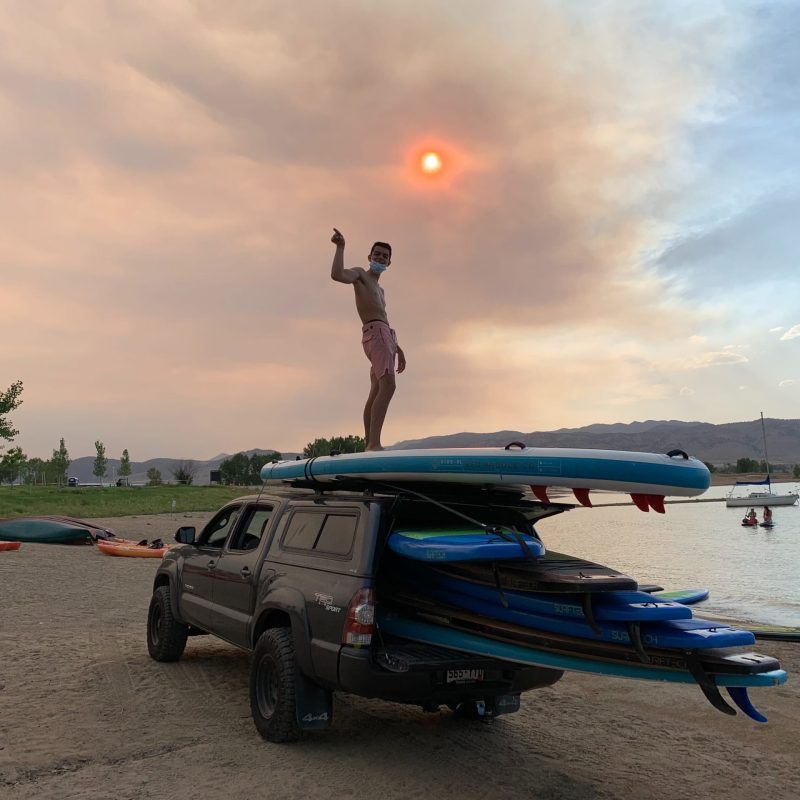 a boat sitting on top of a sandy beach
