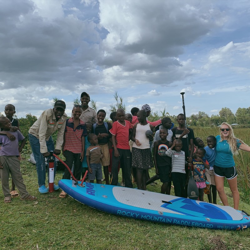 a group of people standing on a beach
