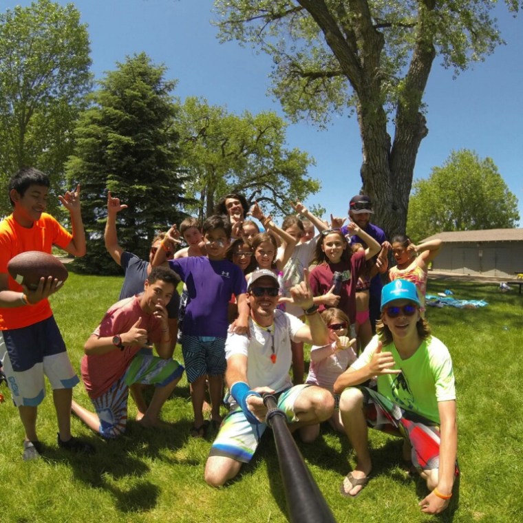 a group of people playing frisbee in a park