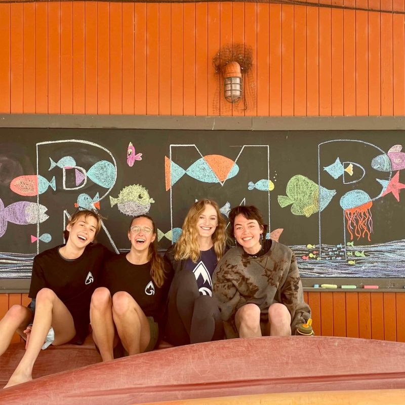 a group of people sitting posing for the camera