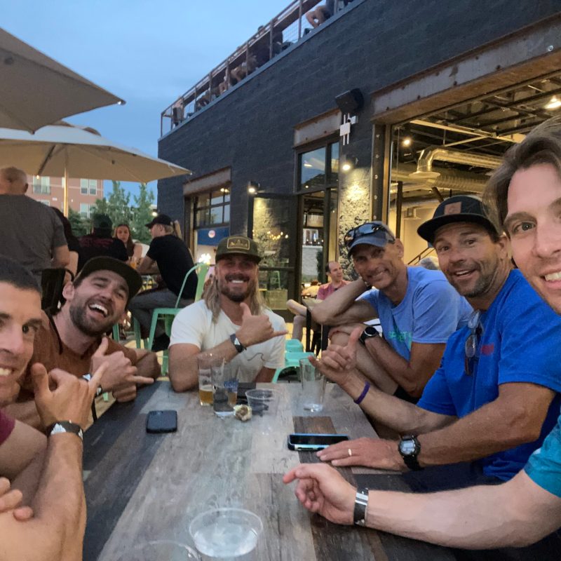 Ryan Boone et al. drinking wine at a restaurant